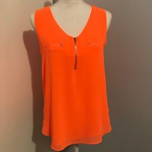 Bright orange top with zipper detail